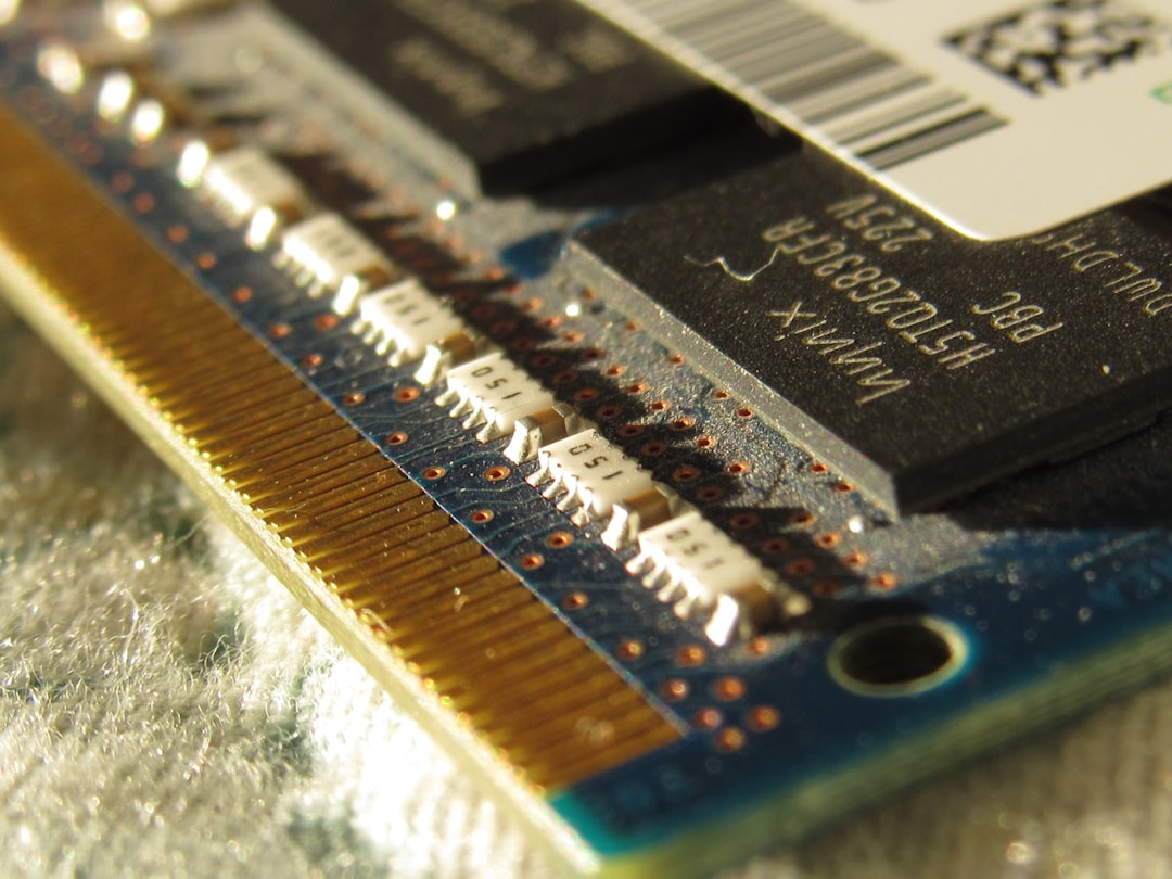 A close up of a computer motherboard with a small chip