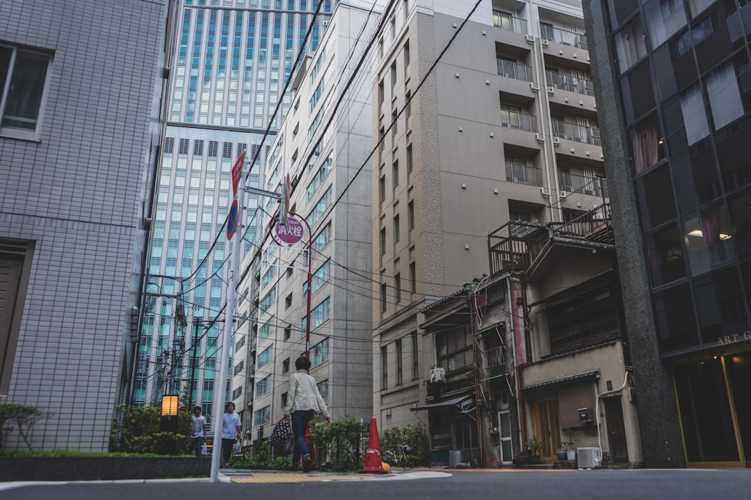 a street with buildings and people